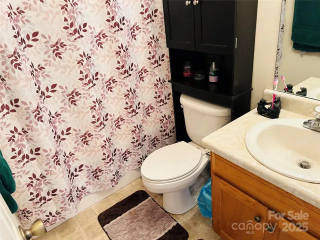 a view of yard from a chairs and table in the patio