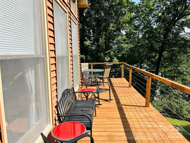 a balcony view with a seating space