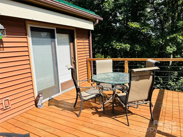a view of patio from deck having patio
