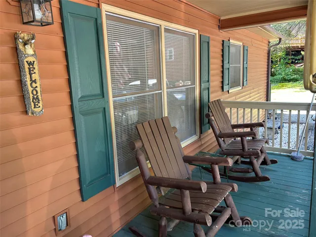 a view of a balcony with chairs