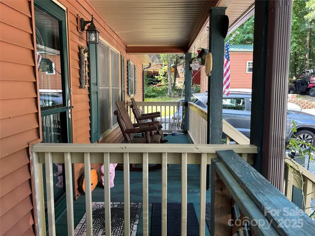 a view of balcony with wooden floor and outdoor space