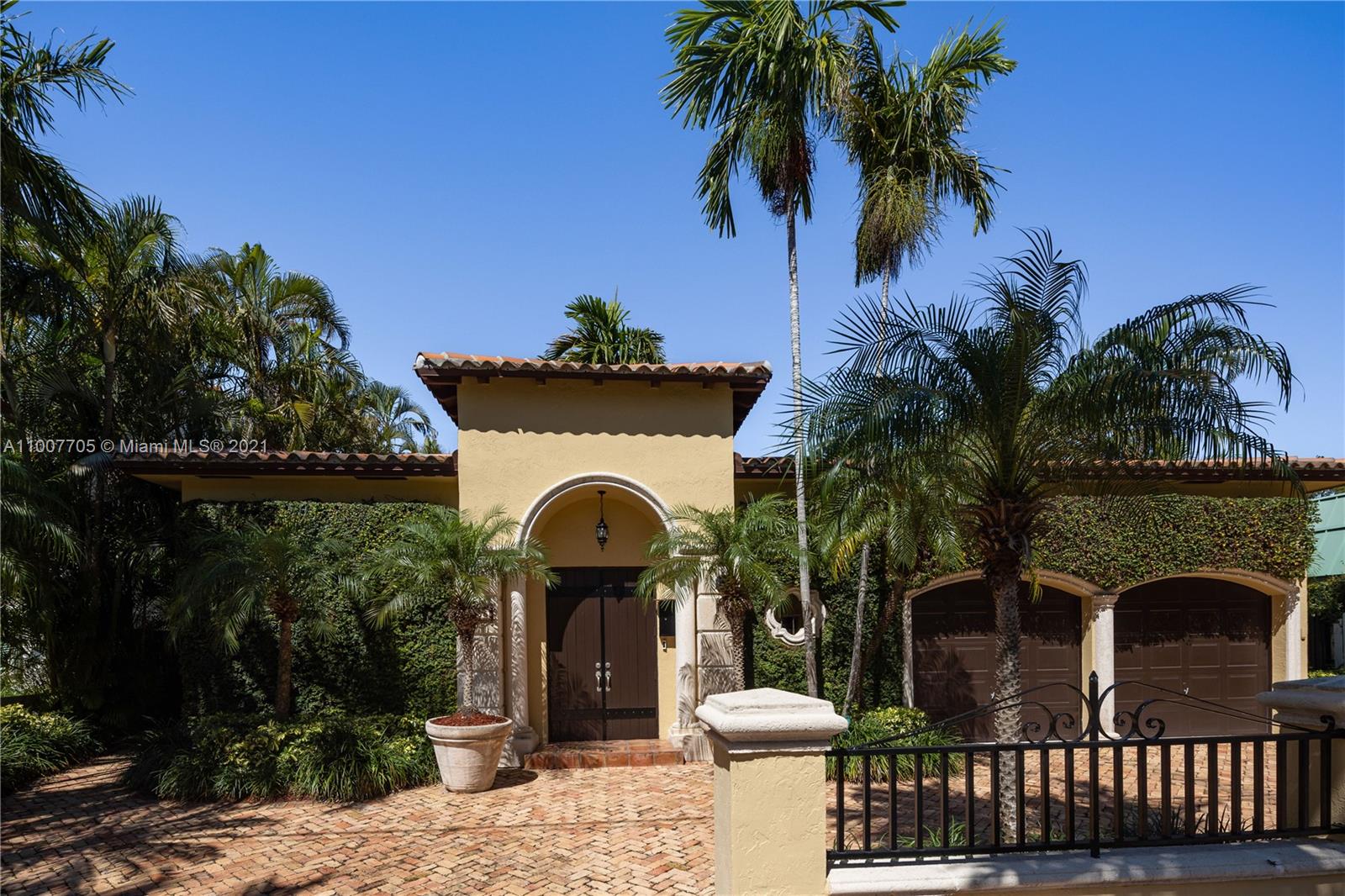 1385 North Biscayne Point Road Miami Beach, FL 33141 - Photo 1 of 68 a front view of a house with garden