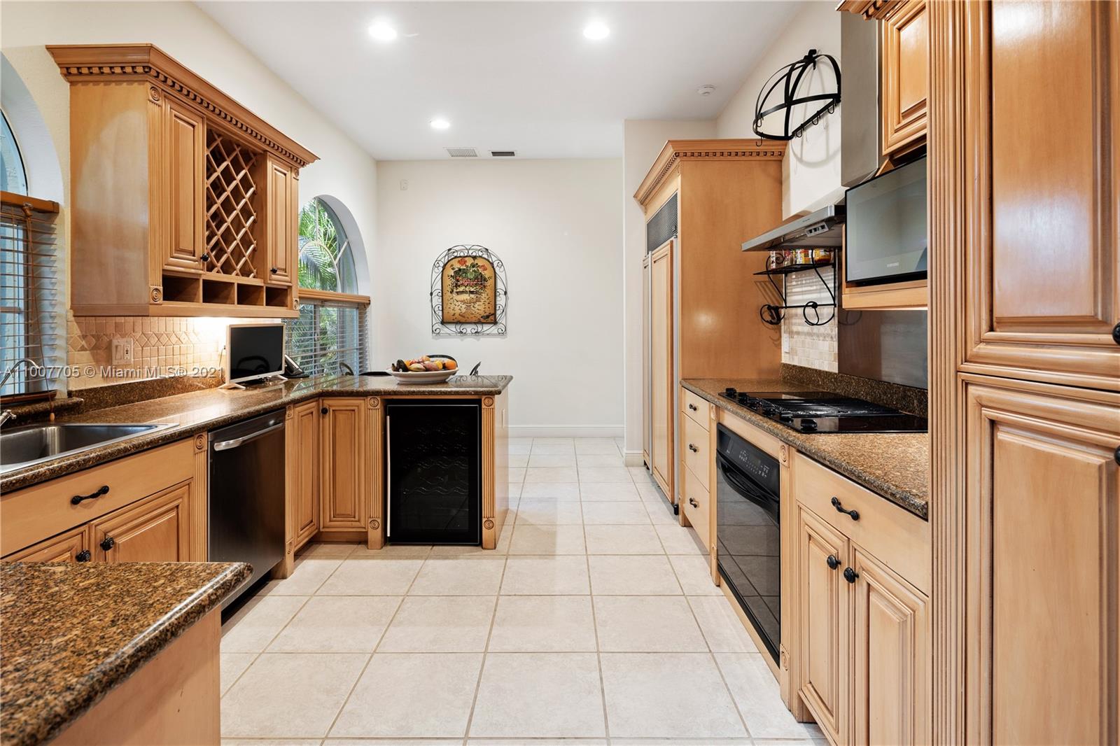 1385 North Biscayne Point Road Miami Beach, FL 33141 - Photo 13 of 68 a kitchen with stainless steel appliances granite countertop a stove a sink and a refrigerator