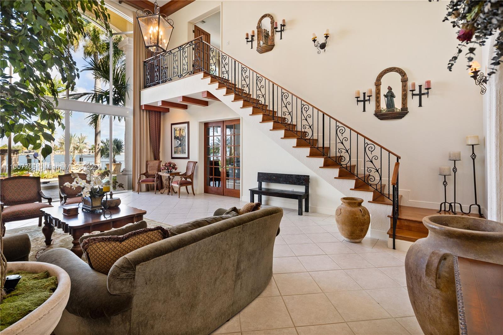 1385 North Biscayne Point Road Miami Beach, FL 33141 - Photo 18 of 68 a view of living room filled with furniture and a chandelier