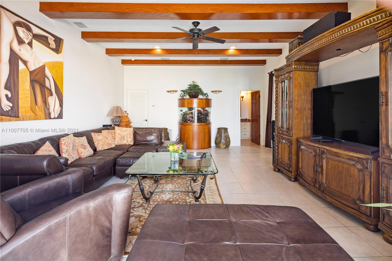 1385 North Biscayne Point Road Miami Beach, FL 33141 - Photo 21 of 68 a living room with furniture and a flat screen tv