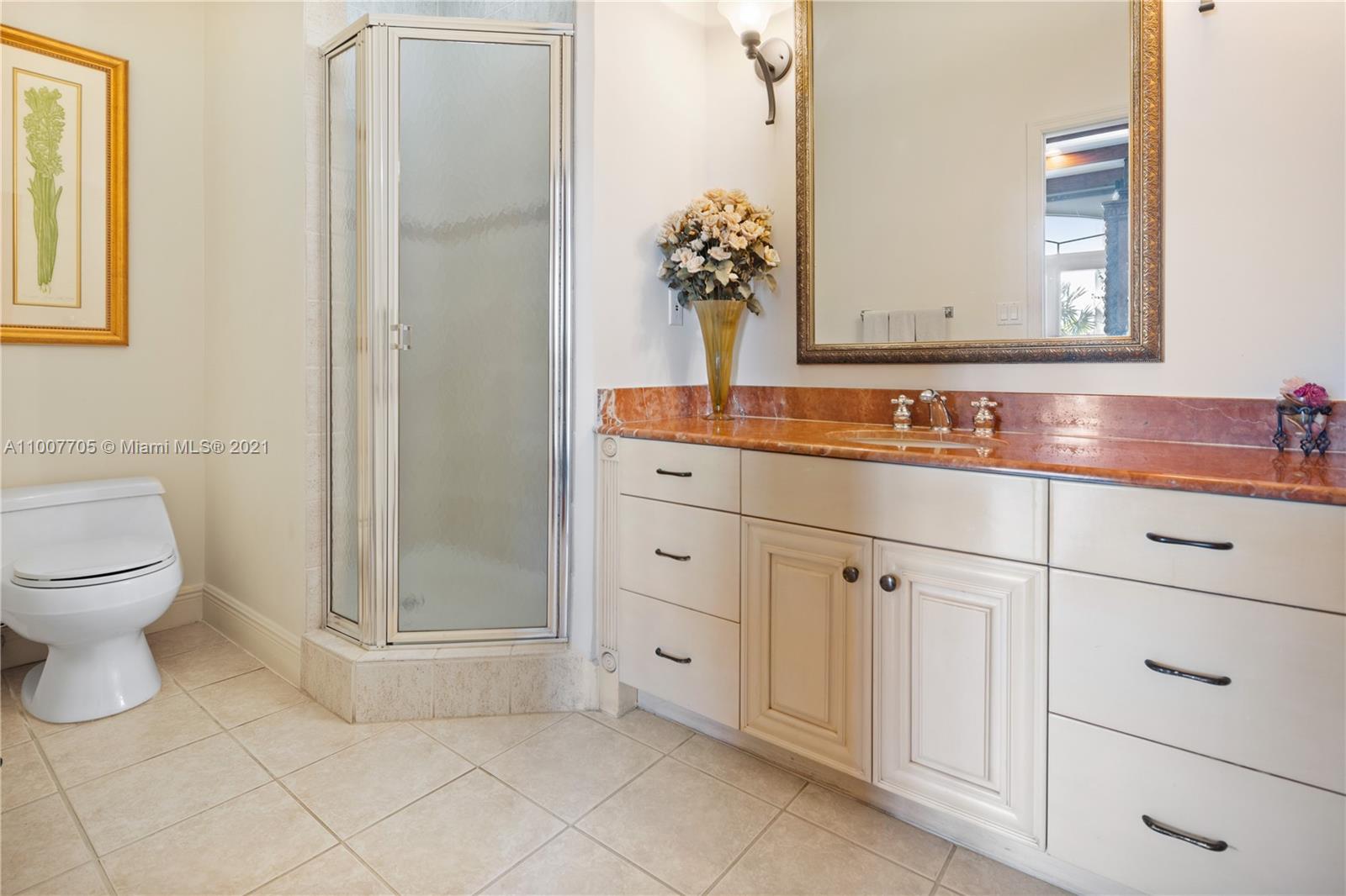 1385 North Biscayne Point Road Miami Beach, FL 33141 - Photo 22 of 68 a bathroom with a sink toilet and shower