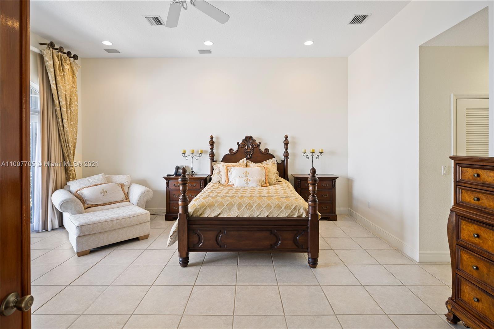 1385 North Biscayne Point Road Miami Beach, FL 33141 - Photo 24 of 68 a living room with furniture and a flat screen tv