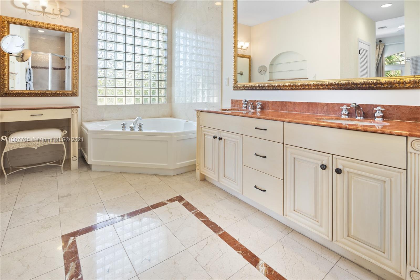1385 North Biscayne Point Road Miami Beach, FL 33141 - Photo 28 of 68 a bathroom with a tub sink and mirror