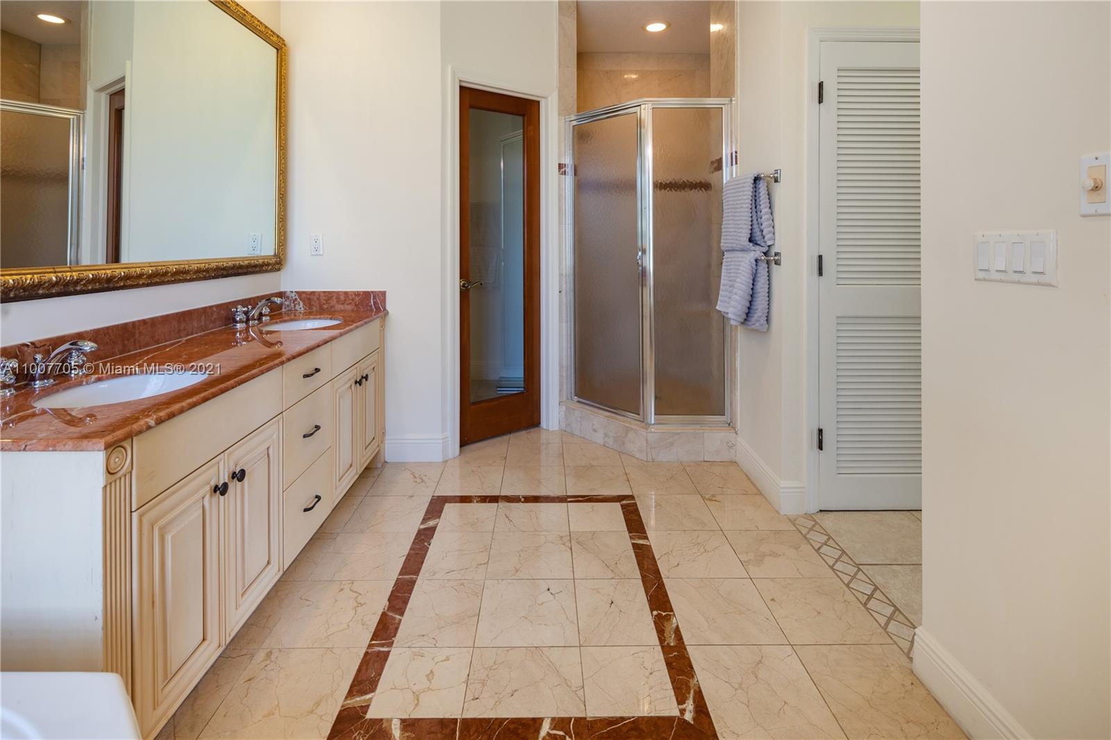 1385 North Biscayne Point Road Miami Beach, FL 33141 - Photo 29 of 68 a bathroom with a sink and a mirror