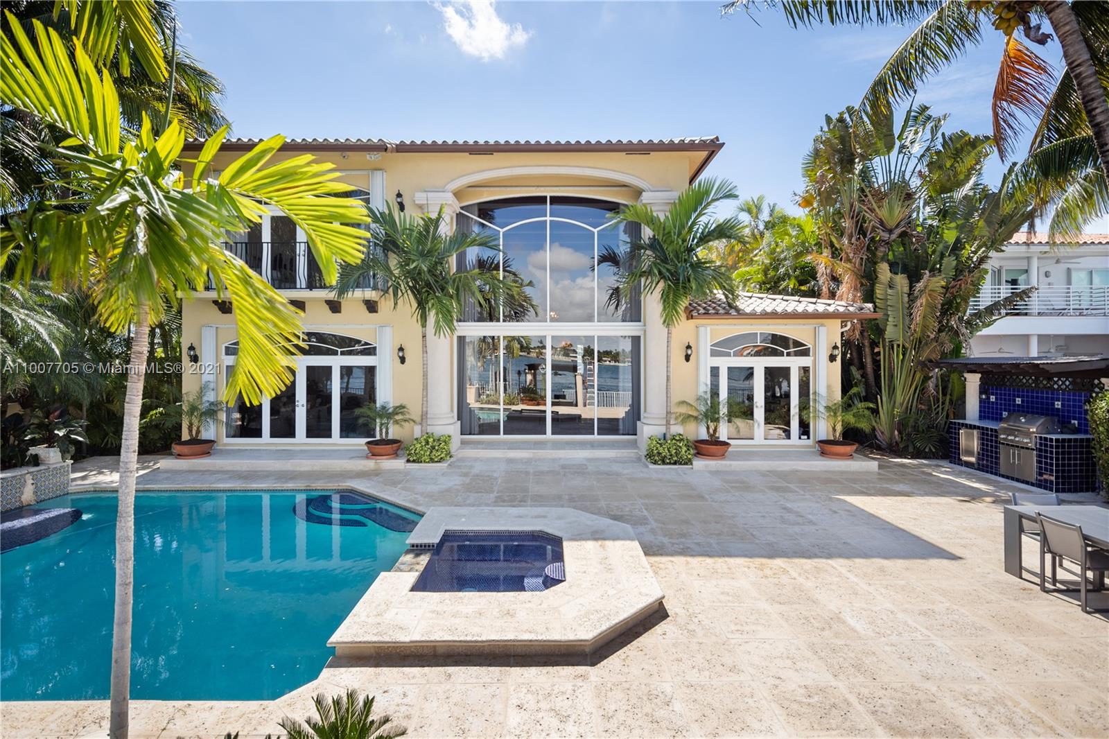 1385 North Biscayne Point Road Miami Beach, FL 33141 - Photo 32 of 68 a front view of a building with a garden