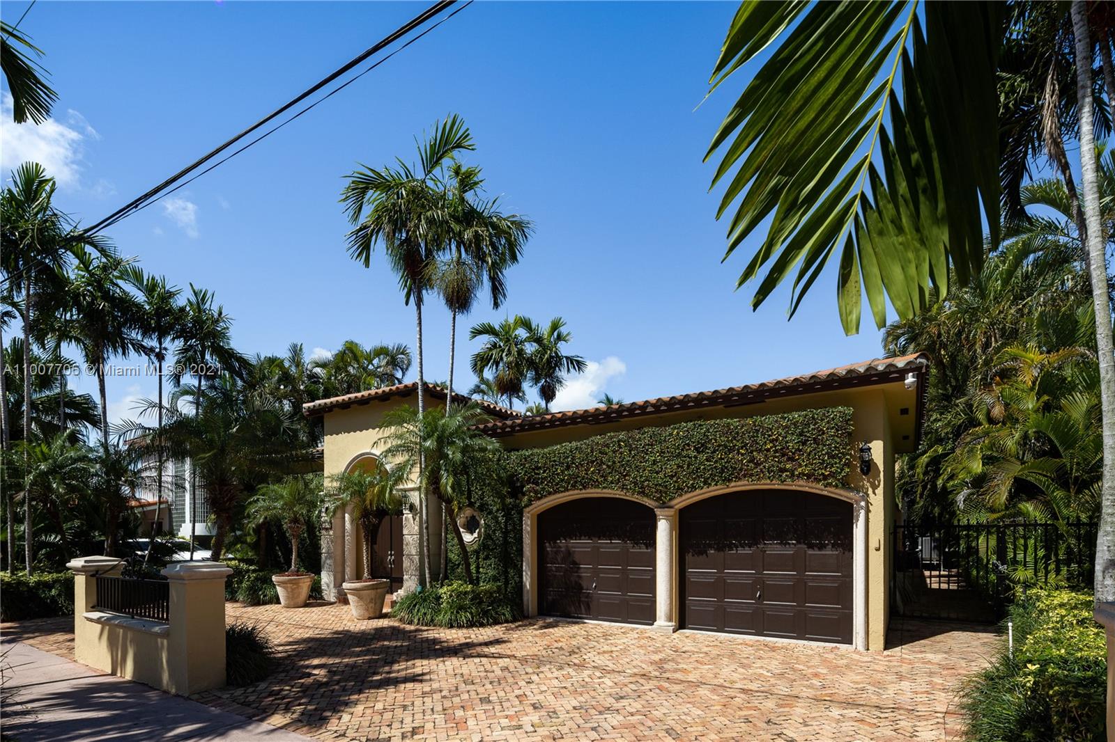 1385 North Biscayne Point Road Miami Beach, FL 33141 - Photo 60 of 68 a front view of a house with a garden