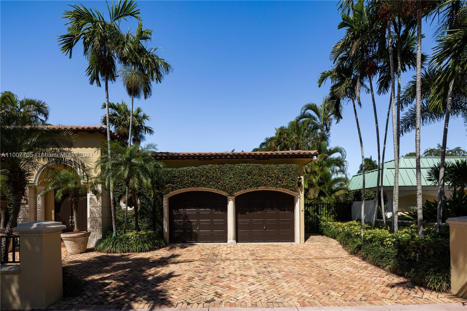 1385 North Biscayne Point Road Miami Beach, FL 33141 - Photo 61 of 68 a front view of a house with a yard and garage