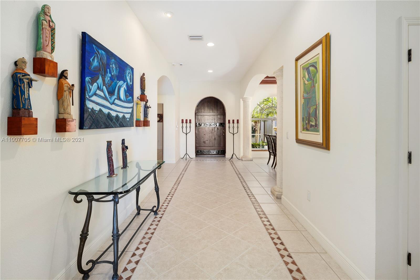 1385 North Biscayne Point Road Miami Beach, FL 33141 - Photo 7 of 68 a view of a hallway with furniture and a potted plant