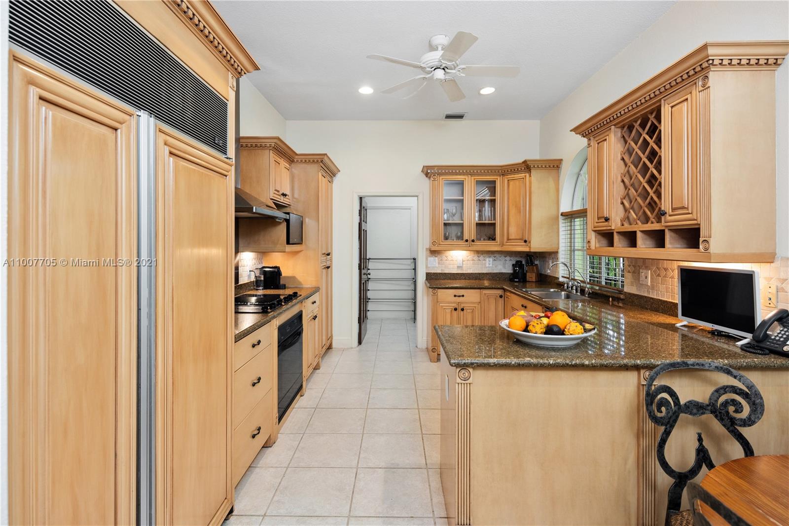 1385 North Biscayne Point Road Miami Beach, FL 33141 - Photo 10 of 68 a kitchen with stainless steel appliances granite countertop a refrigerator a sink dishwasher and a stove with wooden floor
