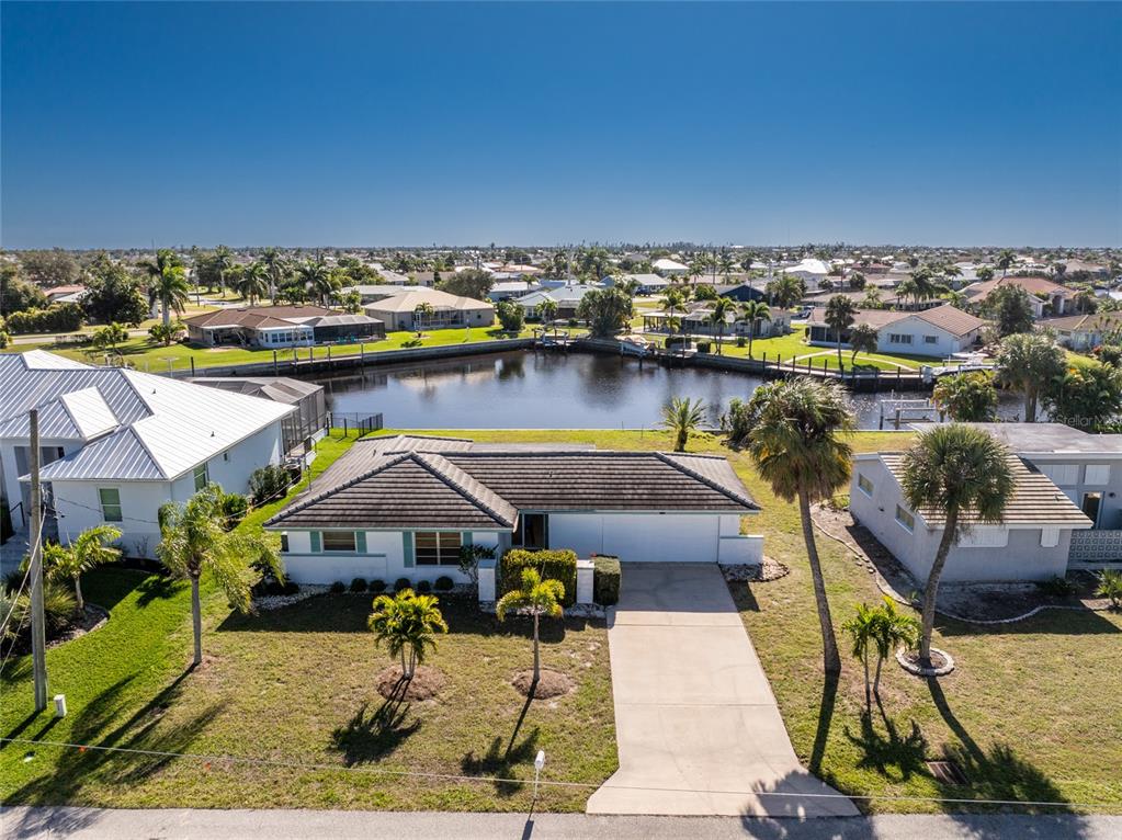1743 Boca Raton Court Punta Gorda, FL 33950 - Photo 1 of 1 Block construction & tile roof situated on a wide turn basin with Gulf access.