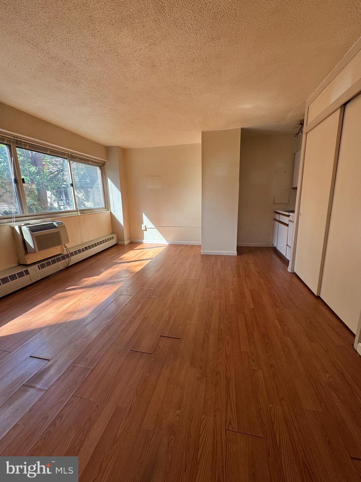 2101 Chestnut Street, Unit 216 Philadelphia, PA 19103 - Photo 7 of 8 a view of a livingroom with wooden floor