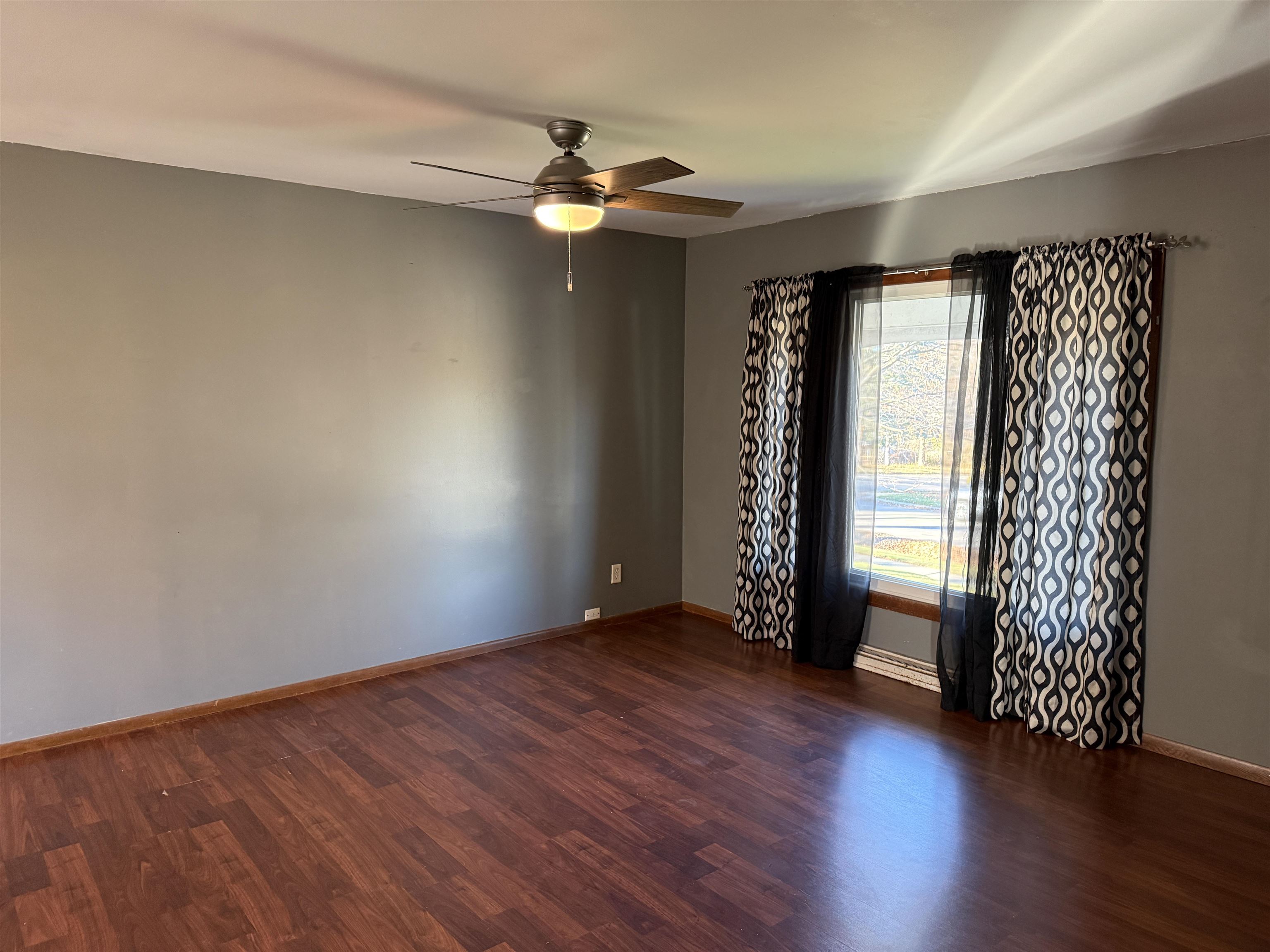 3237 West Carthage Drive Freeport, IL 61032 - Photo 2 of 14 an empty room with wooden floor closet and windows