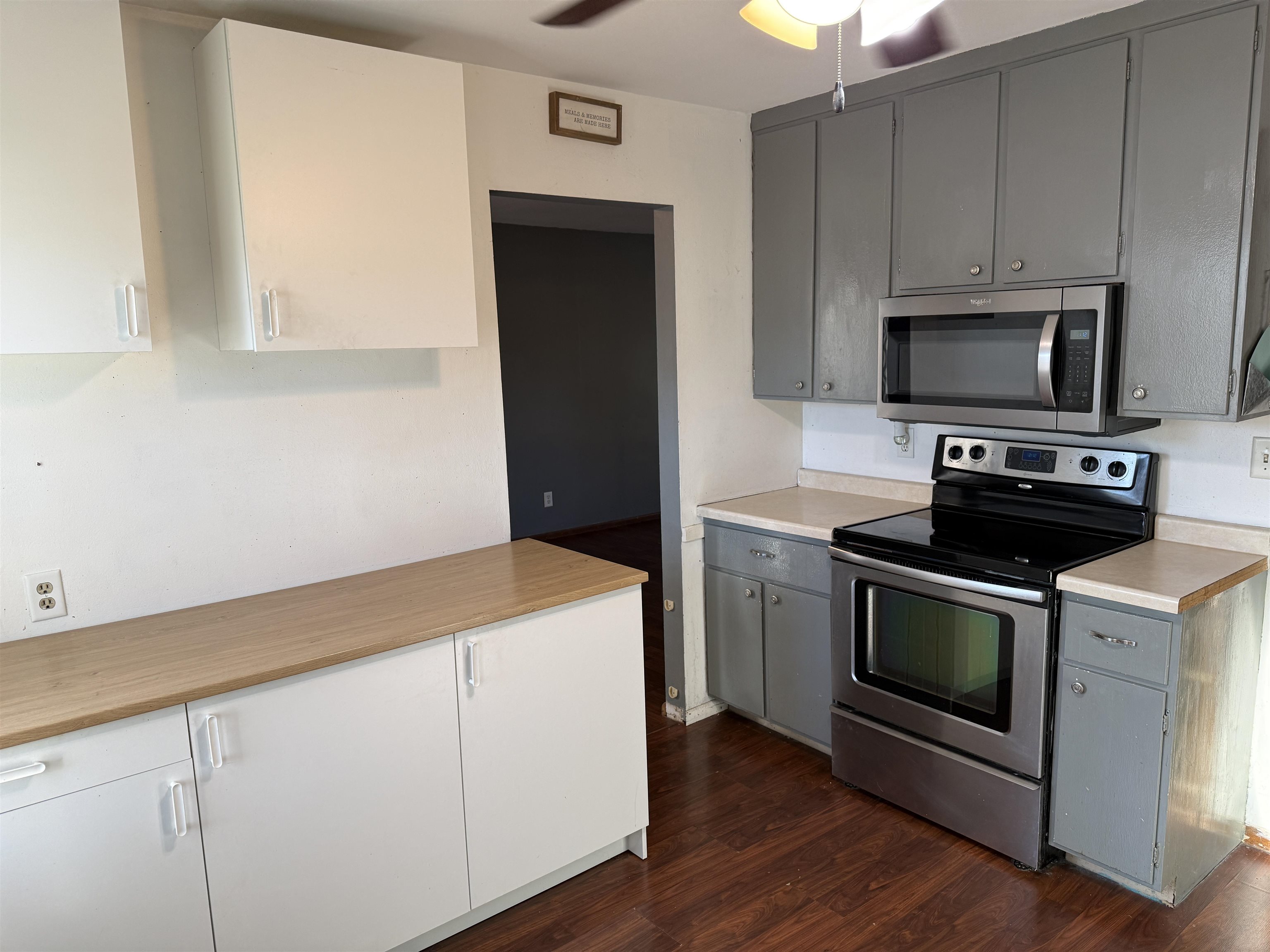 3237 West Carthage Drive Freeport, IL 61032 - Photo 5 of 14 a kitchen with granite countertop white cabinets and stainless steel appliances