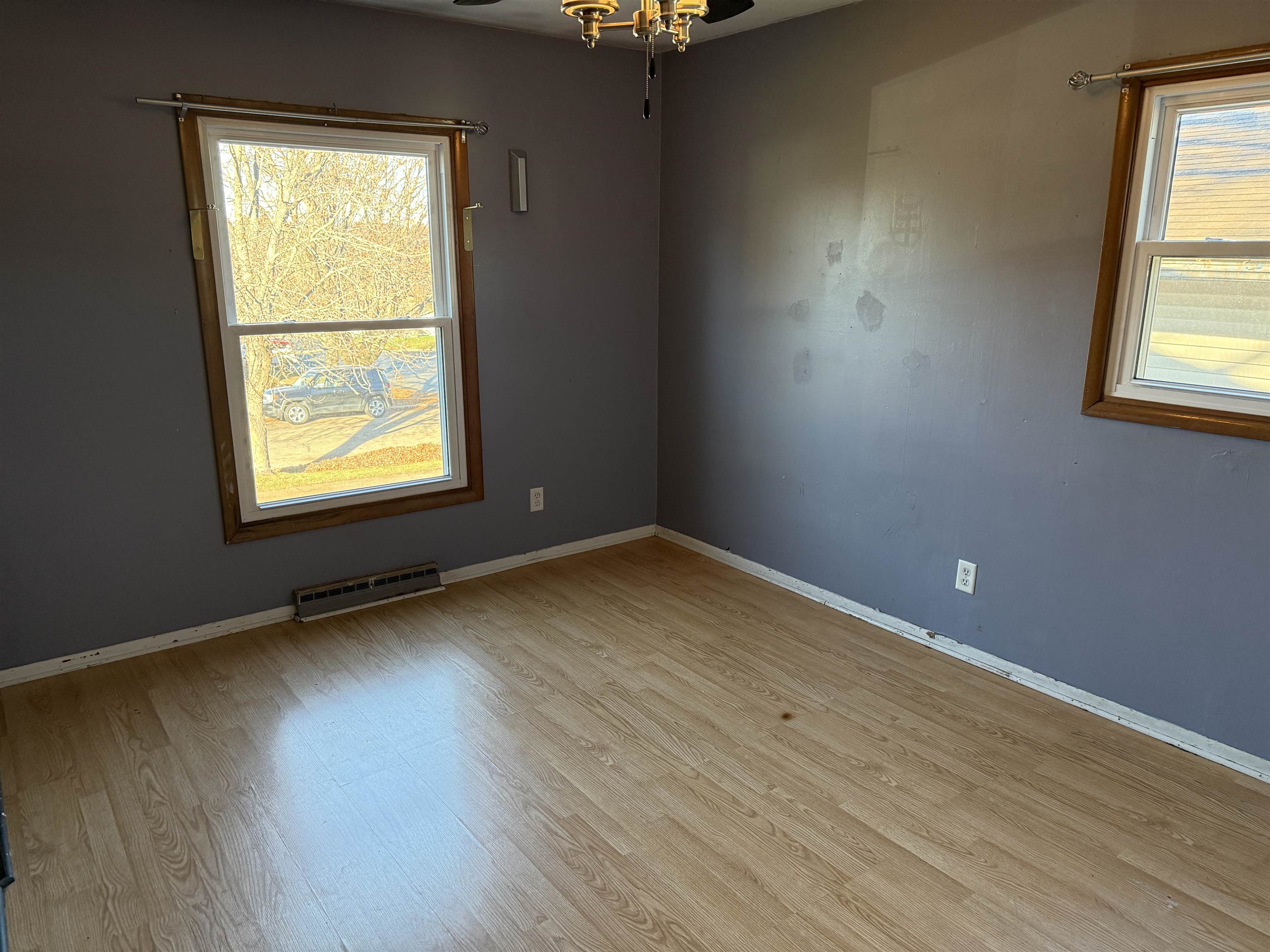 3237 West Carthage Drive Freeport, IL 61032 - Photo 9 of 14 an empty room with wooden floor and windows