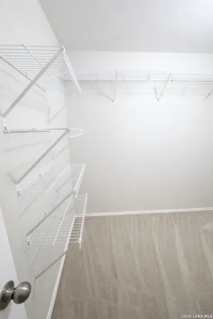 an empty room with a mirror