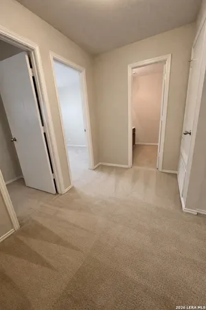 a bathroom with a double vanity sink and a toilet