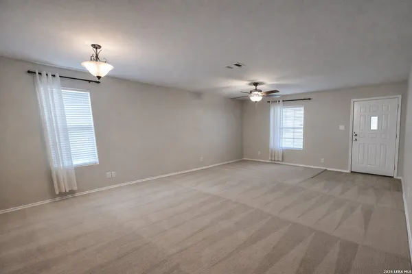 a view of an empty room with a window