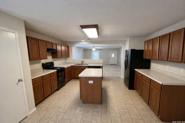 a kitchen with a sink counter top space and appliances