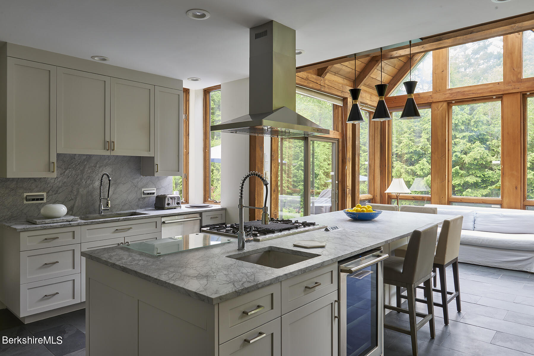 130 Woodmere Road Becket, MA 01223 - Photo 11 of 50 a kitchen with granite countertop a sink and a window
