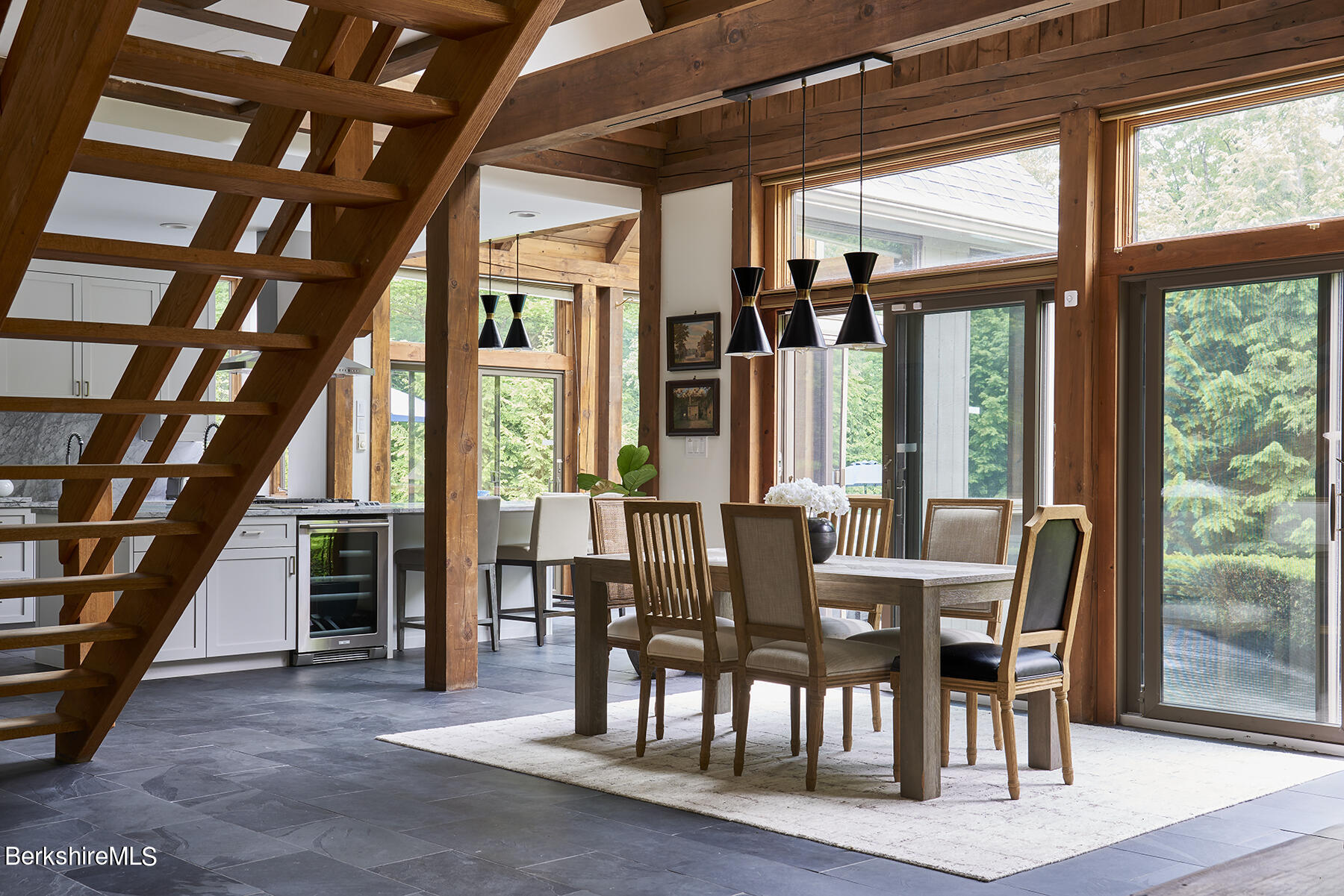 130 Woodmere Road Becket, MA 01223 - Photo 12 of 50 a view of a dining room with furniture window and wooden floor