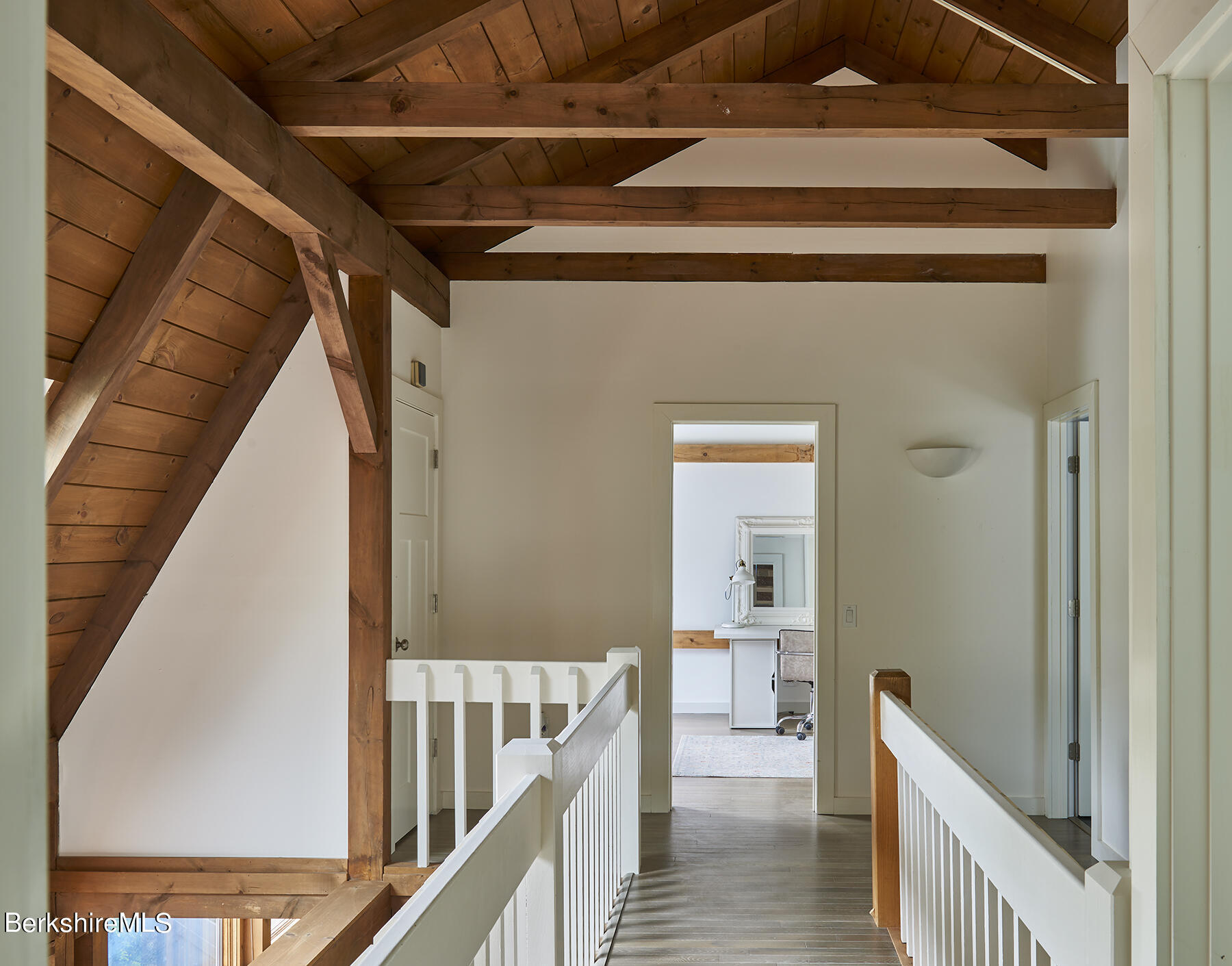 130 Woodmere Road Becket, MA 01223 - Photo 18 of 50 a view of a hallway with wooden floor and staircase