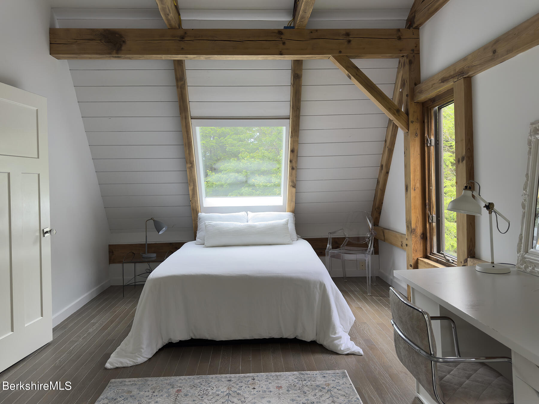 130 Woodmere Road Becket, MA 01223 - Photo 20 of 50 a bedroom with a bed a mirror and a window