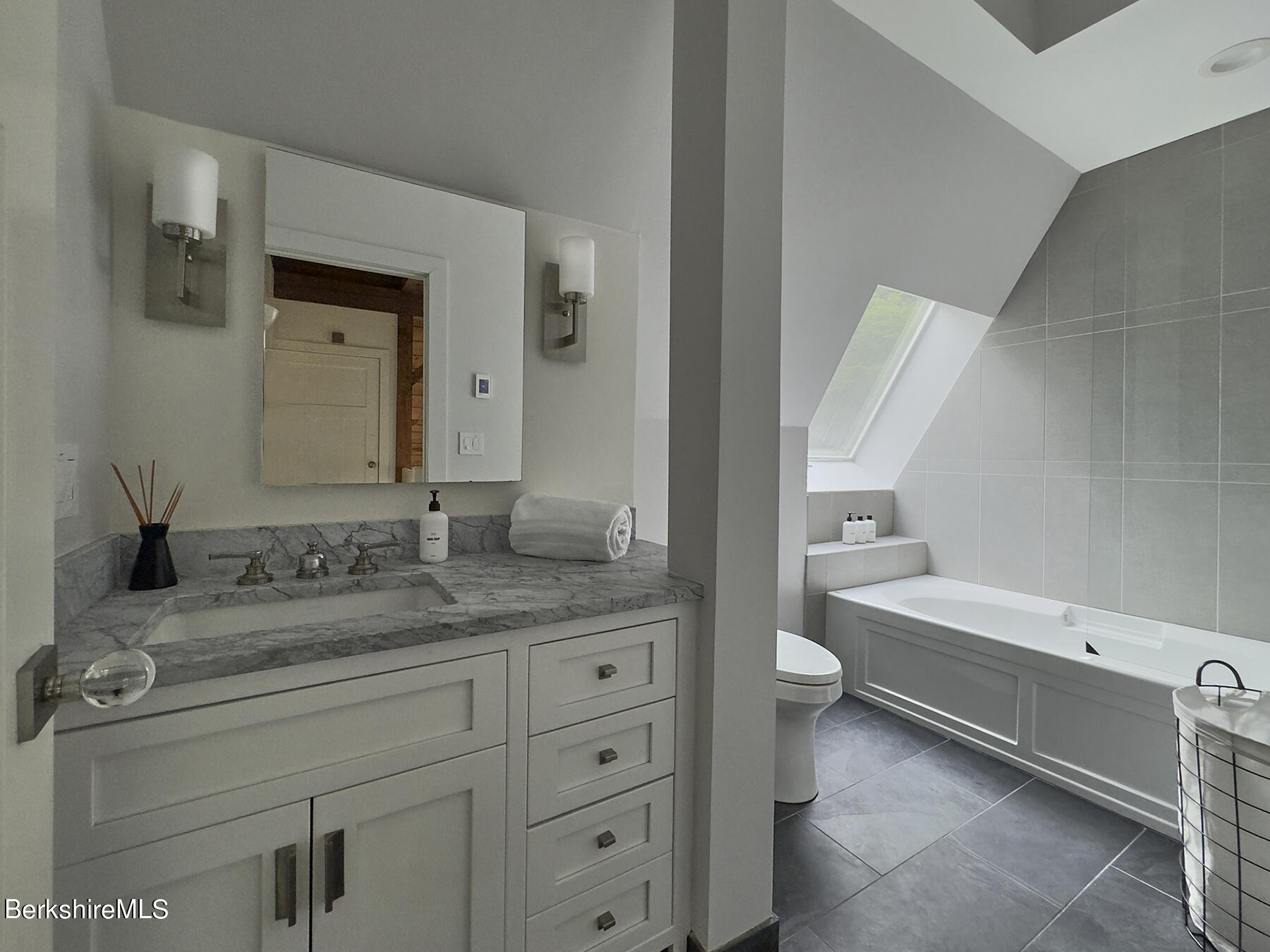 130 Woodmere Road Becket, MA 01223 - Photo 21 of 50 a bathroom with a double vanity sink and a mirror