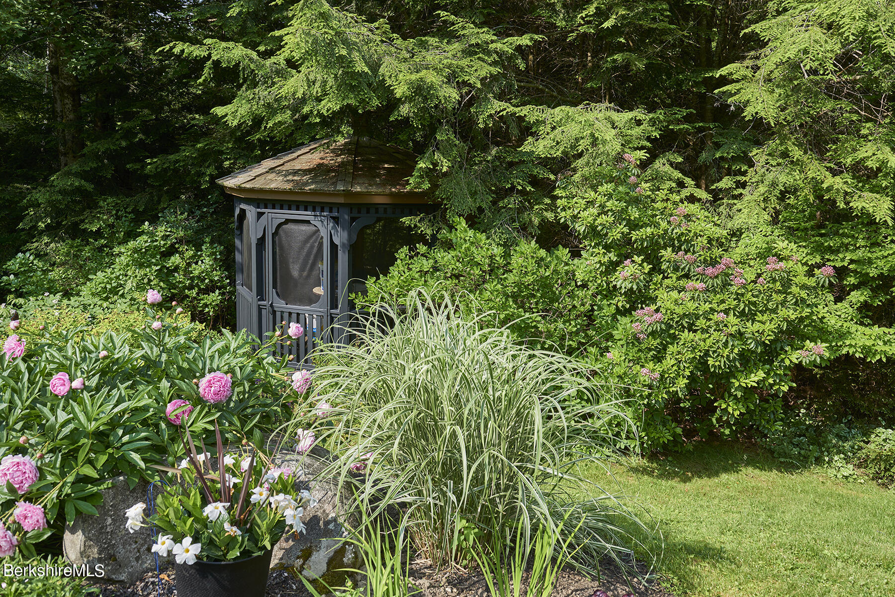 130 Woodmere Road Becket, MA 01223 - Photo 27 of 50 a backyard of a house with lots of green space