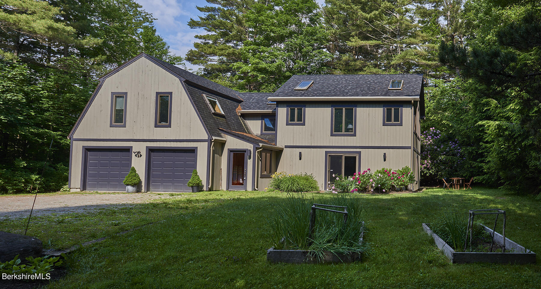 130 Woodmere Road Becket, MA 01223 - Photo 35 of 50 a front view of a house with a yard