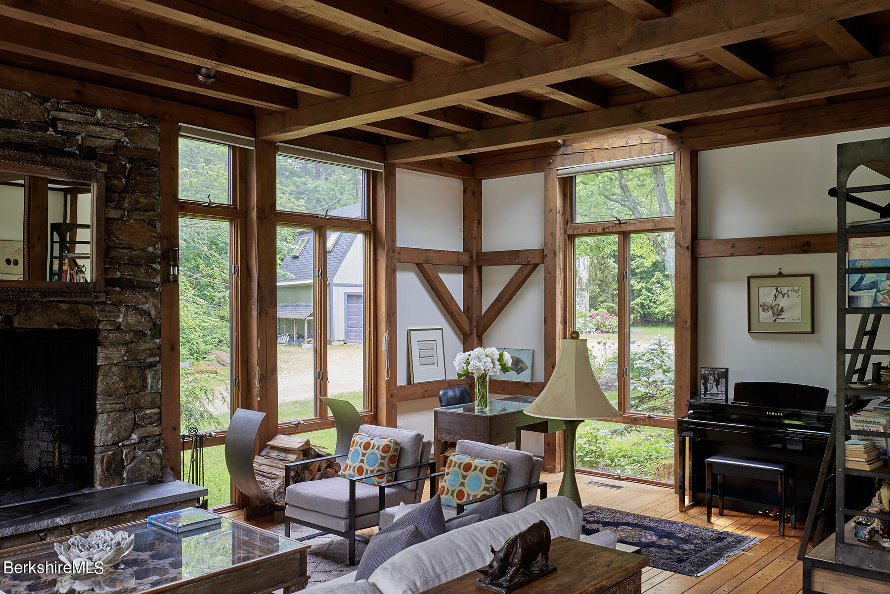 130 Woodmere Road Becket, MA 01223 - Photo 4 of 50 a living room with furniture a wooden floor and a fireplace