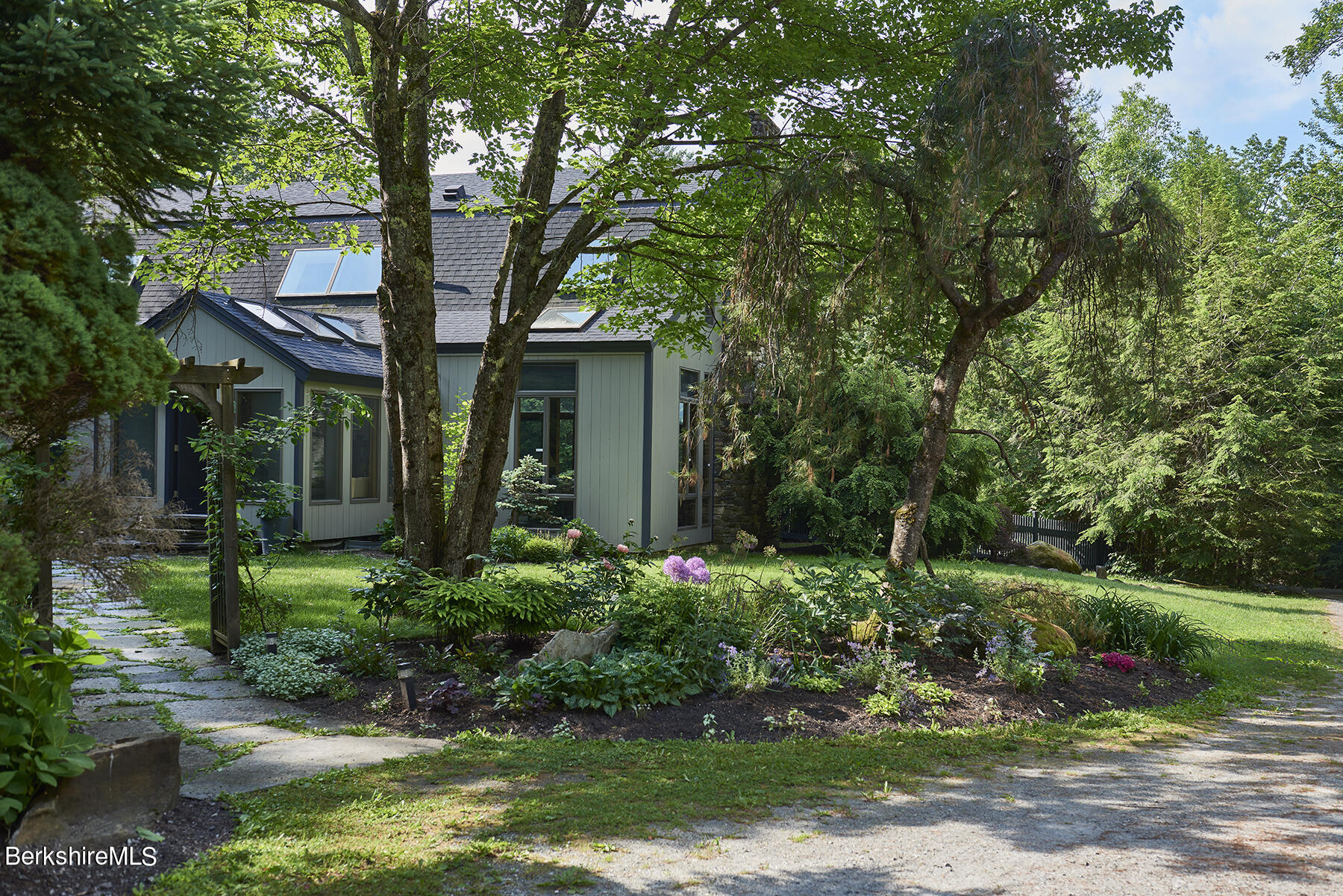 130 Woodmere Road Becket, MA 01223 - Photo 48 of 50 front view of a house with a yard