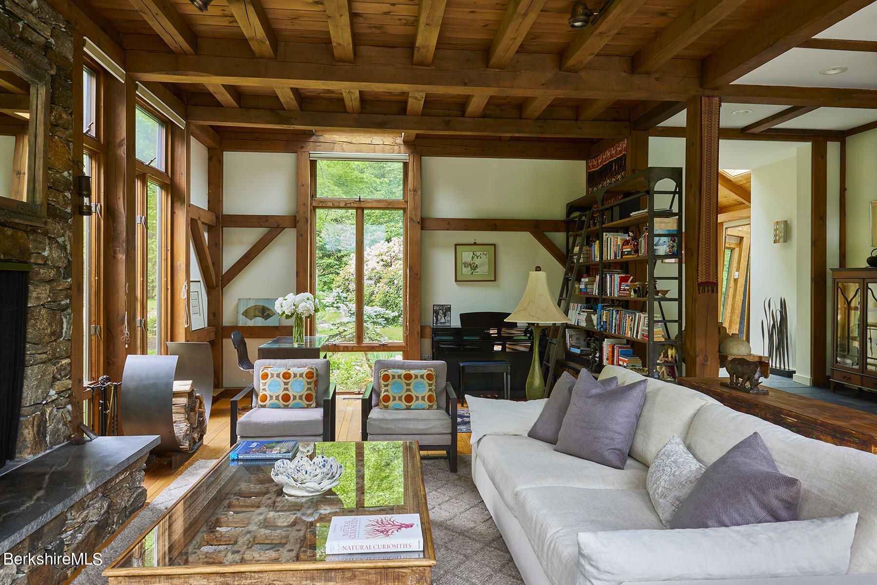 130 Woodmere Road Becket, MA 01223 - Photo 5 of 50 a living room with furniture or couch and a large window