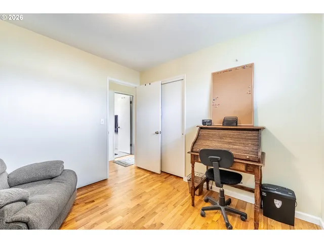 a bedroom with a bed and a couch