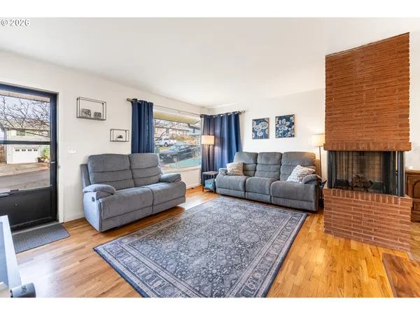 a living room with furniture and a rug