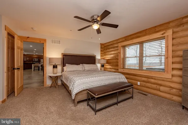 a bedroom with a bed and window