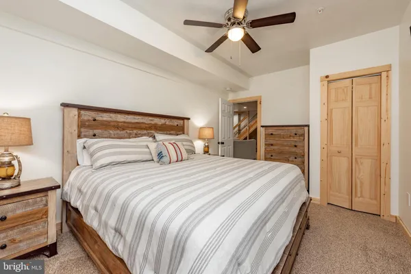 a bedroom with a bed and dresser
