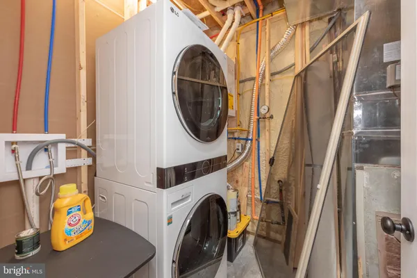 a view of deck with two chair and a barbeque