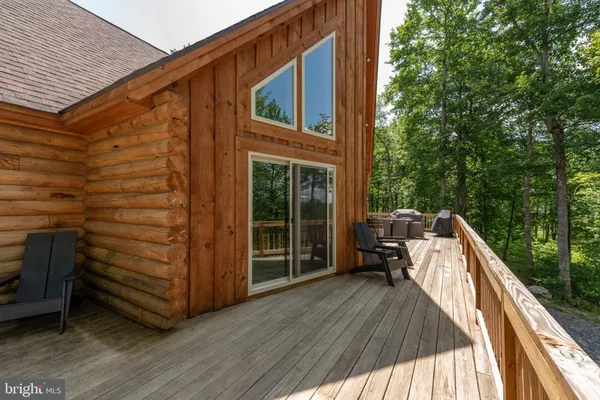 a view of roof deck with furniture