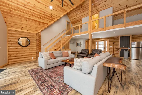 a living room with furniture and a rug