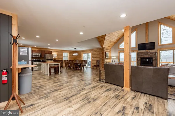 a living room with furniture and kitchen view