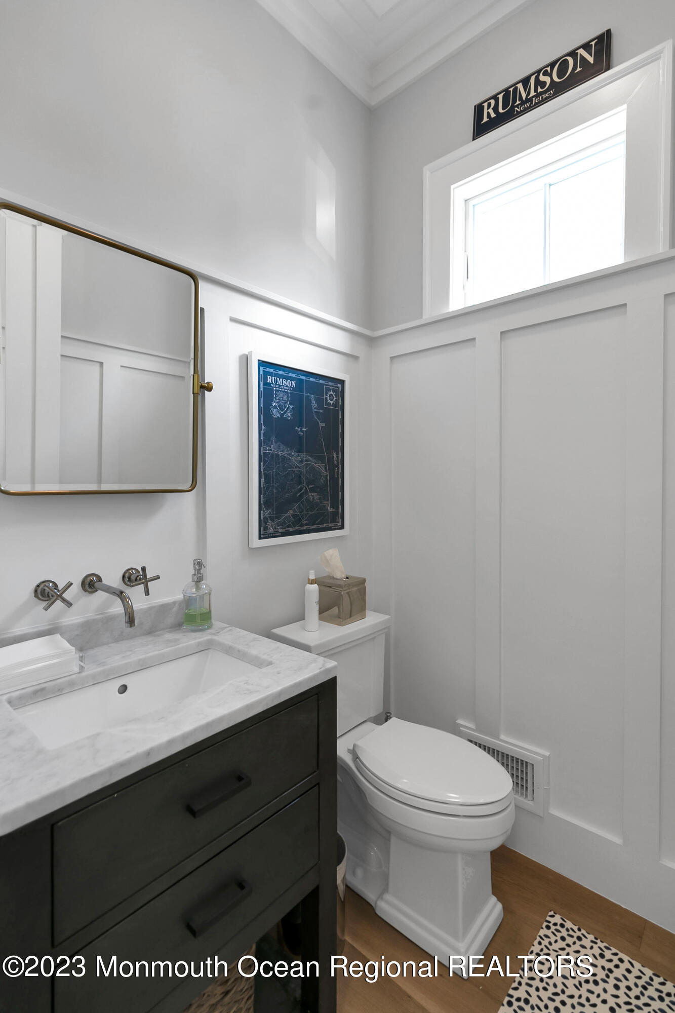 9 Allen Street Rumson, NJ 07760 - Photo 23 of 43 a bathroom with a toilet a sink a mirror and a window