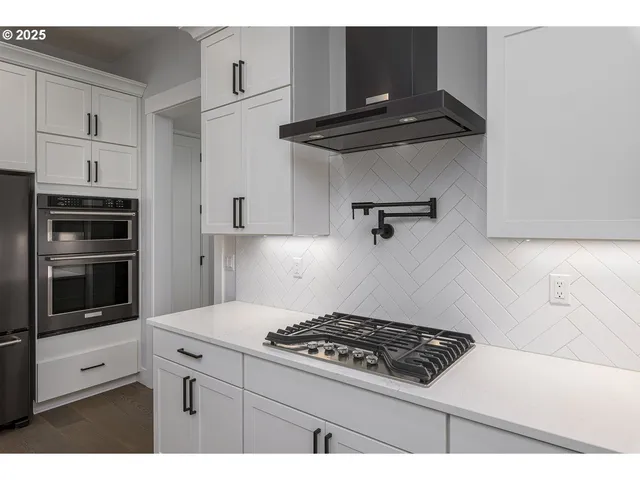 a view of hallway with wooden floor
