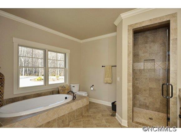 340 Porters Ridge Canton, NC 28716 - Photo 14 of 22 a bathroom with a bathtub and a shower