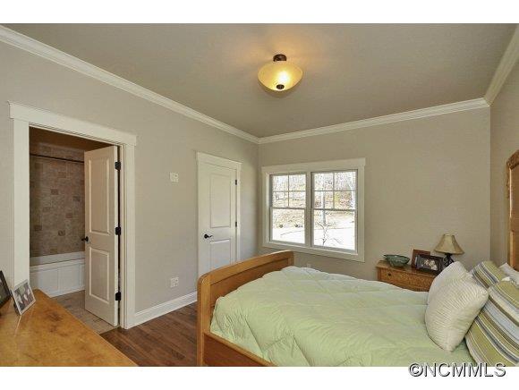340 Porters Ridge Canton, NC 28716 - Photo 15 of 22 a bedroom with a bed and a window