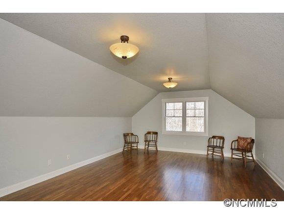 340 Porters Ridge Canton, NC 28716 - Photo 17 of 22 a view of an empty room with wooden floor and a window